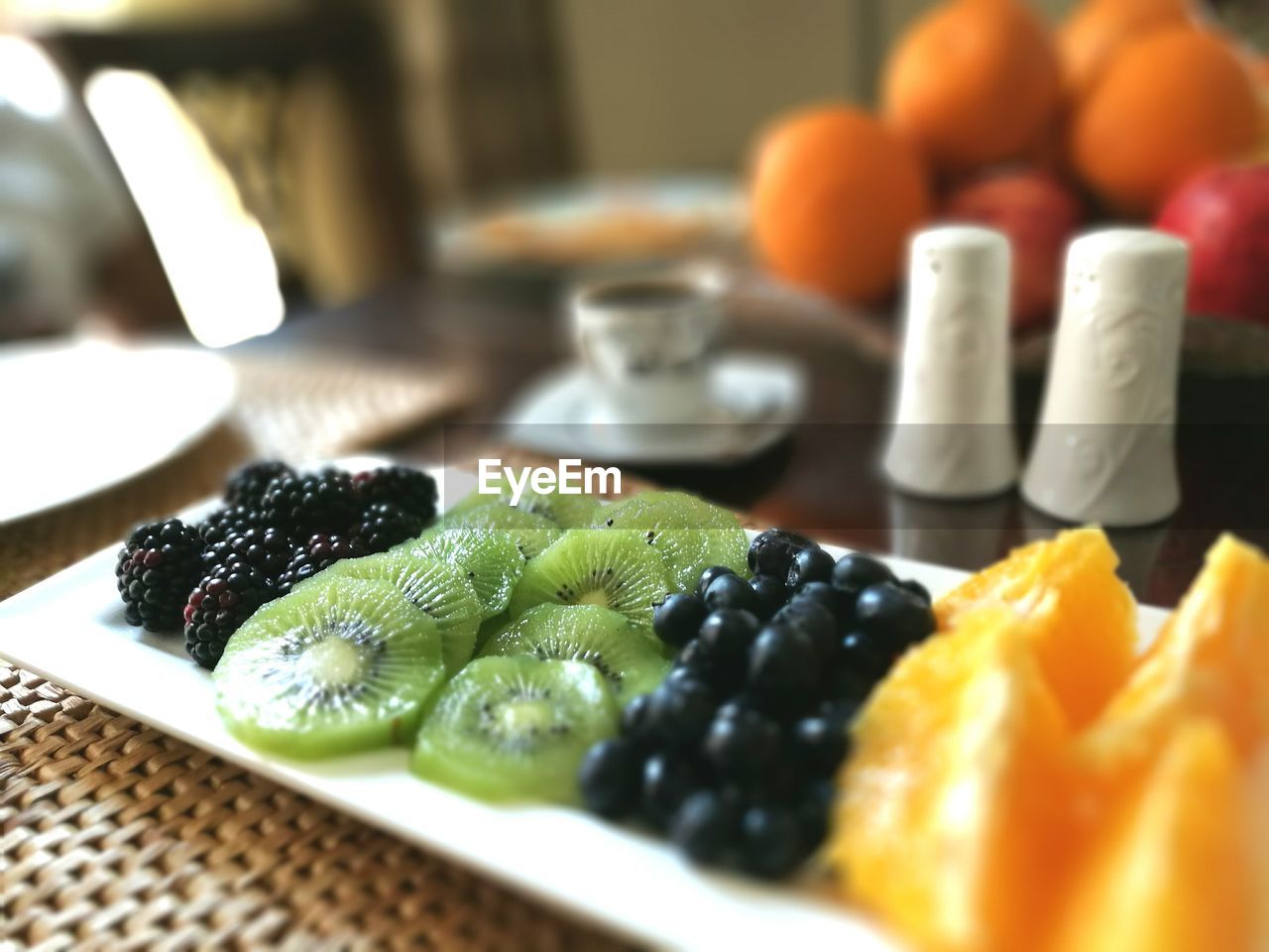 Fruits in plate on table