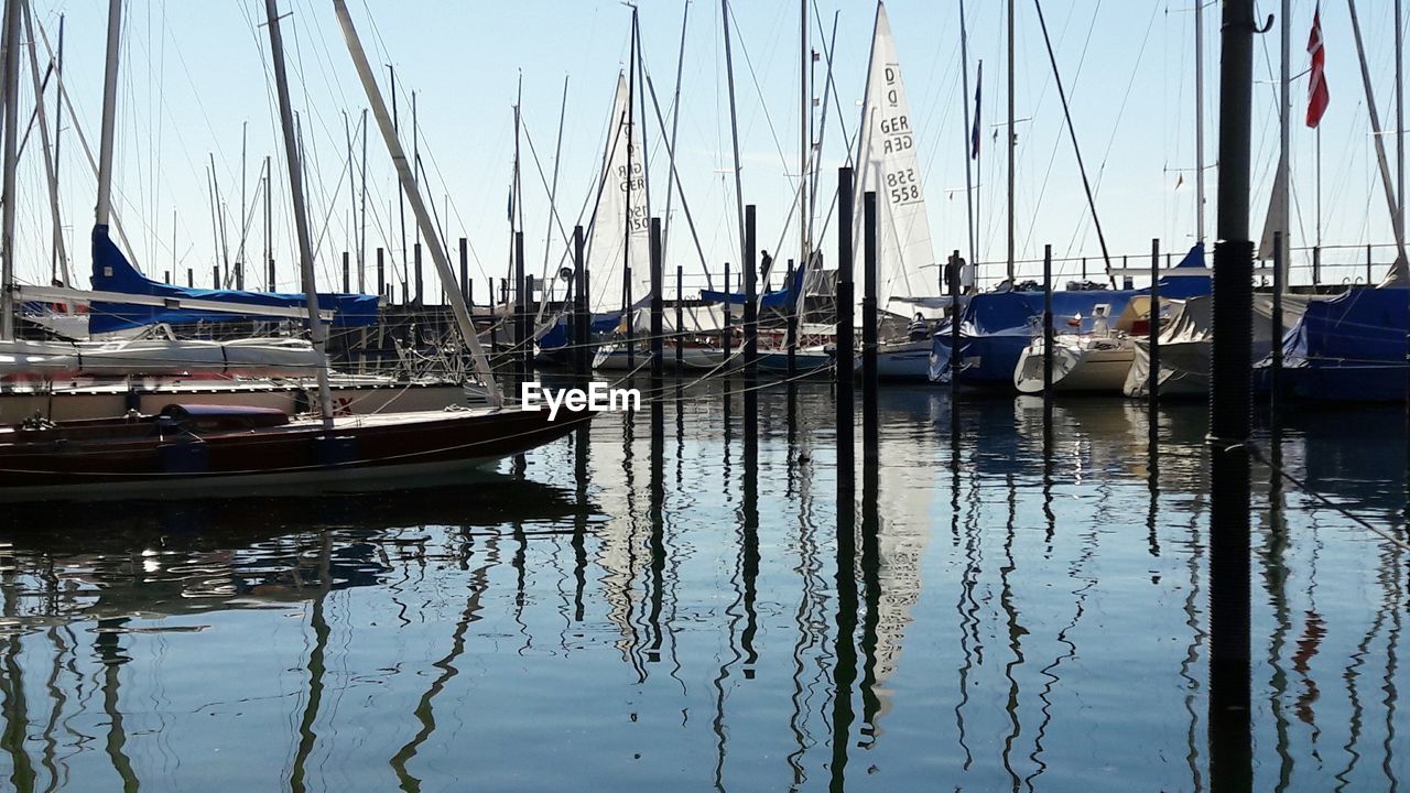 BOATS MOORED IN SEA