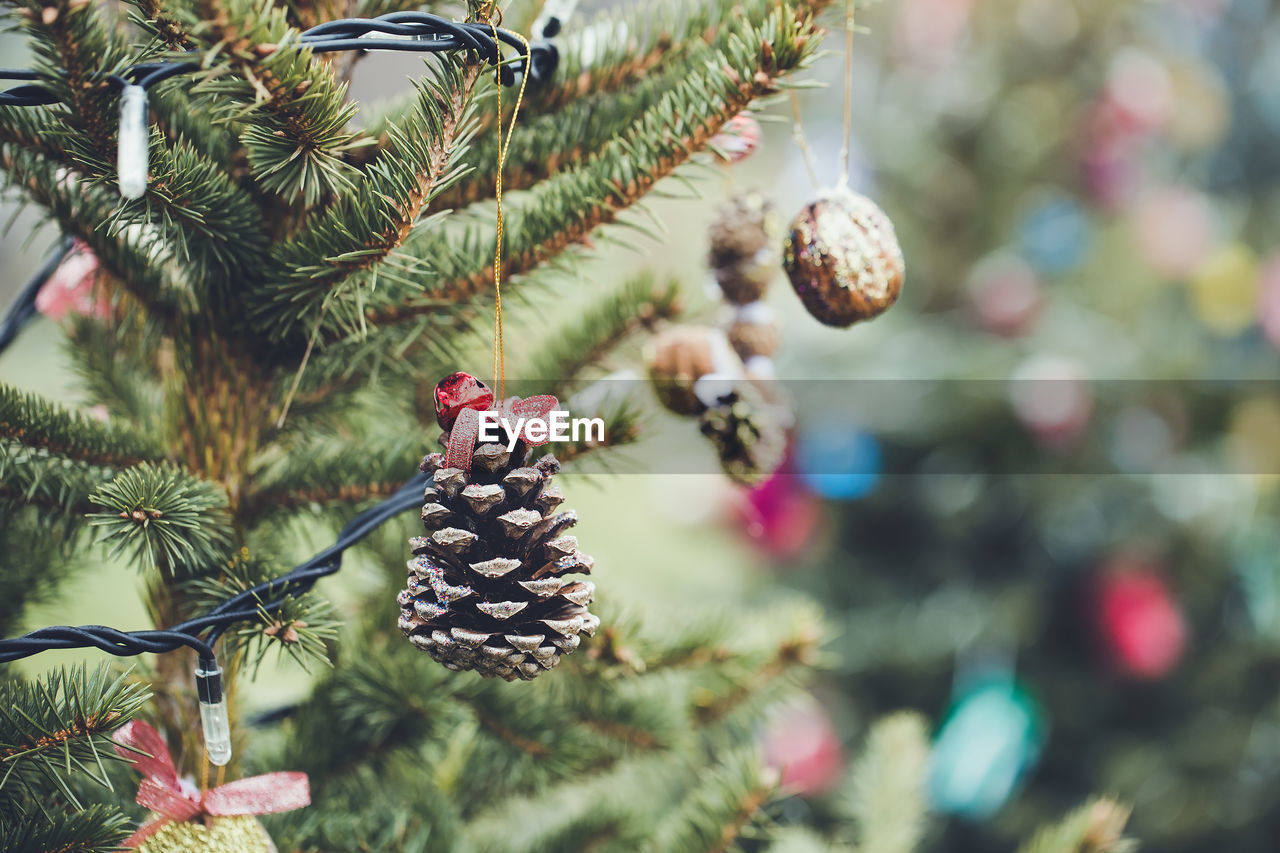 Handmade pine cone decoration on christmas tree. diy ideas for children. environment, recycle