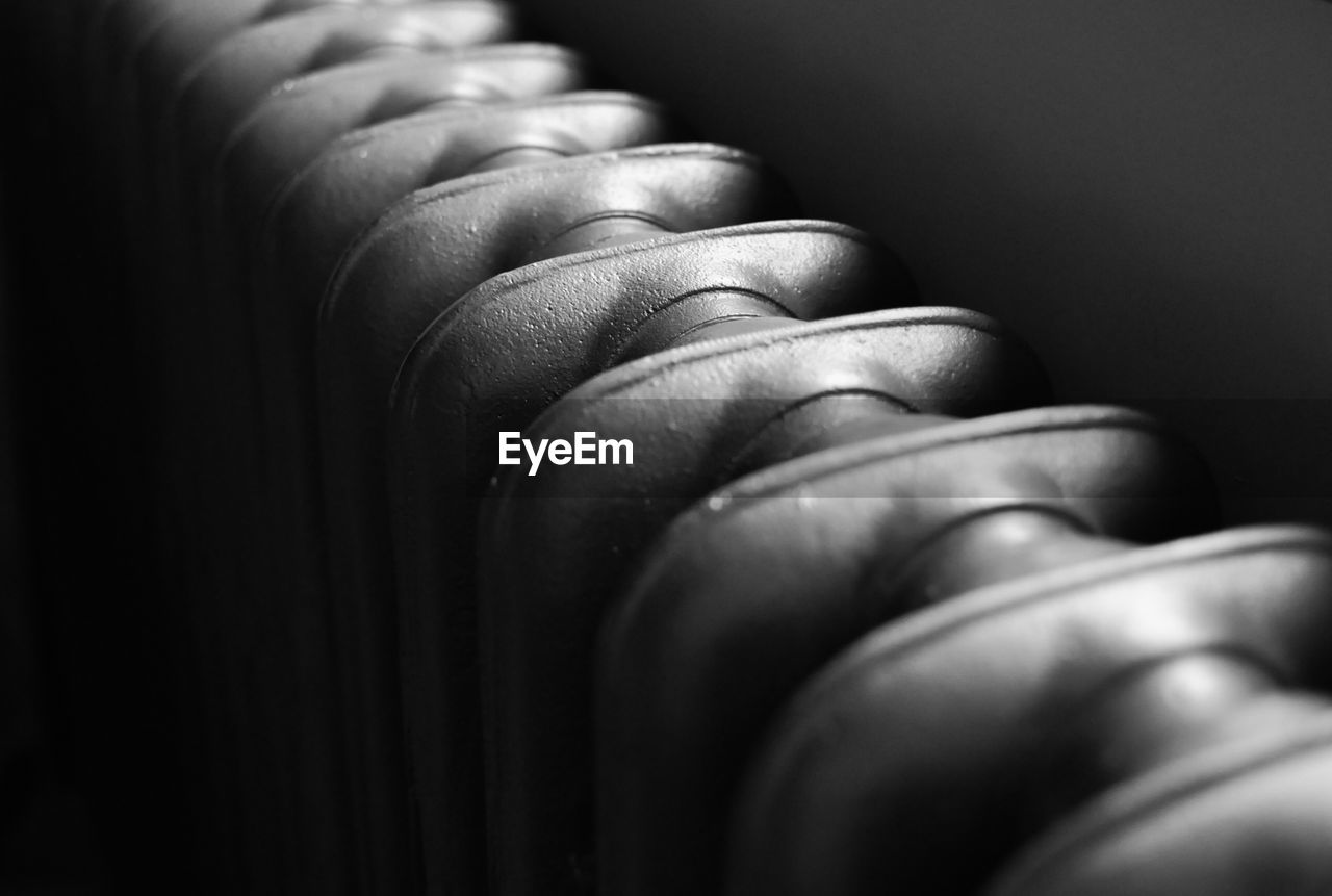 Close-up of radiator in darkroom
