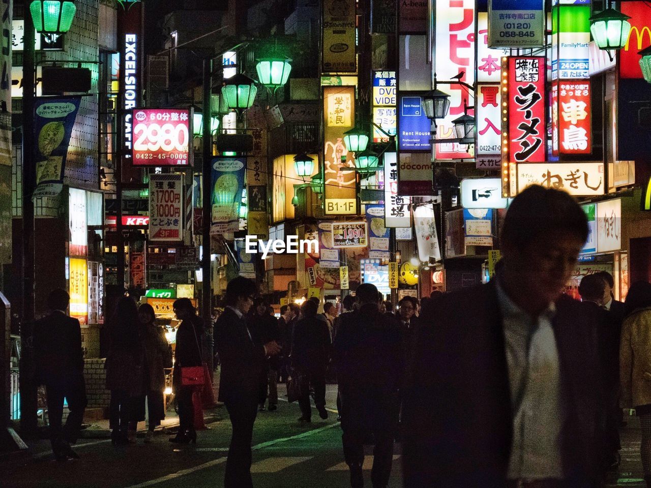 VIEW OF ILLUMINATED CITY AT NIGHT