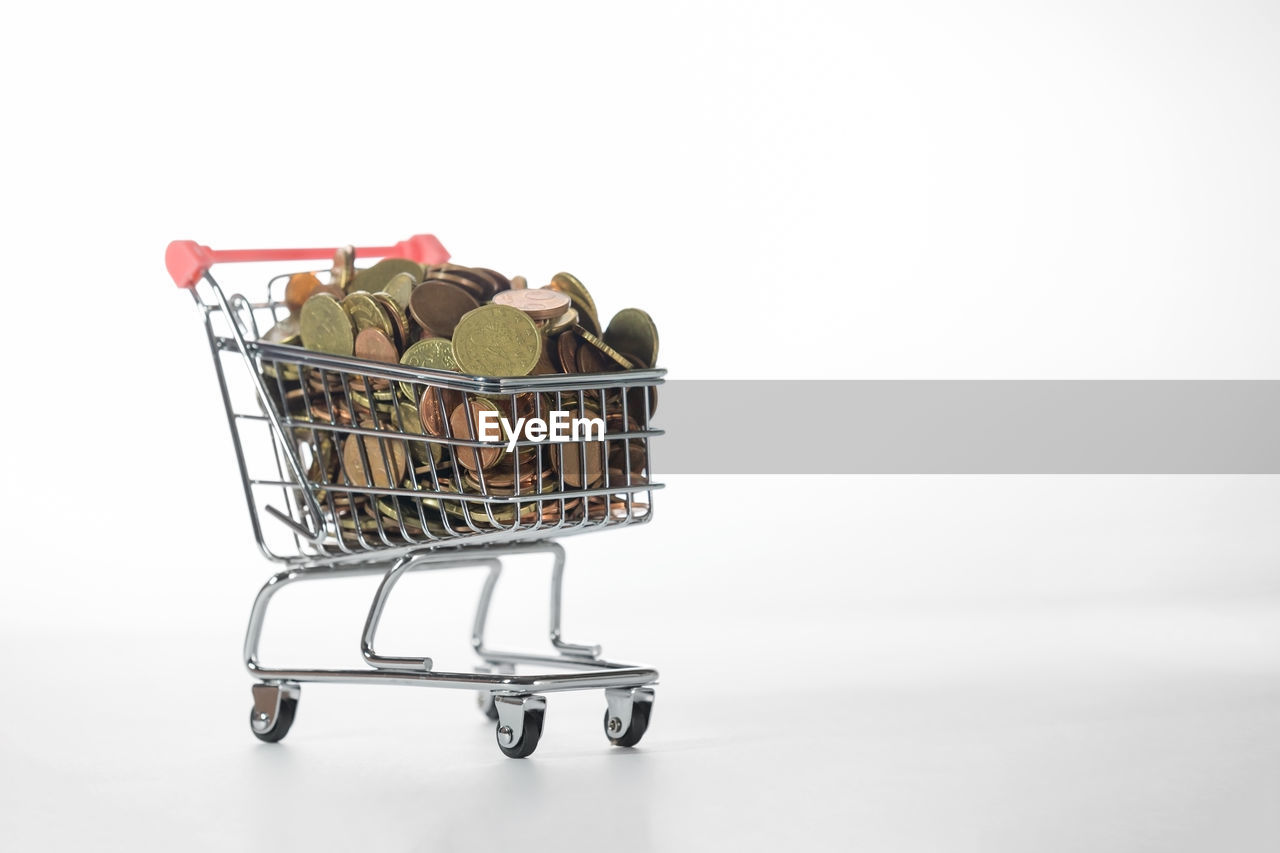 SHOPPING CART AGAINST GRAY BACKGROUND