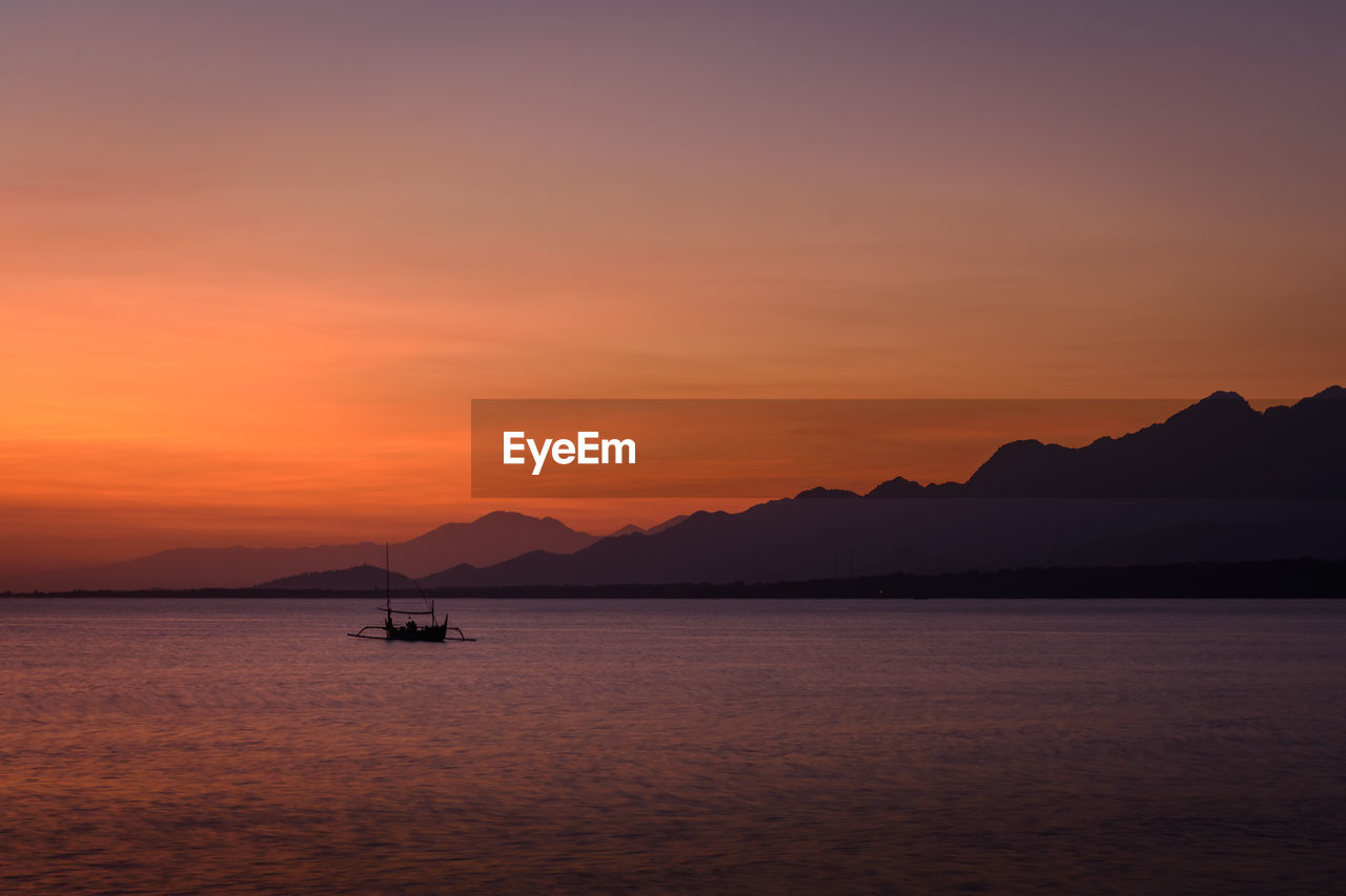 SCENIC VIEW OF SEA DURING SUNSET
