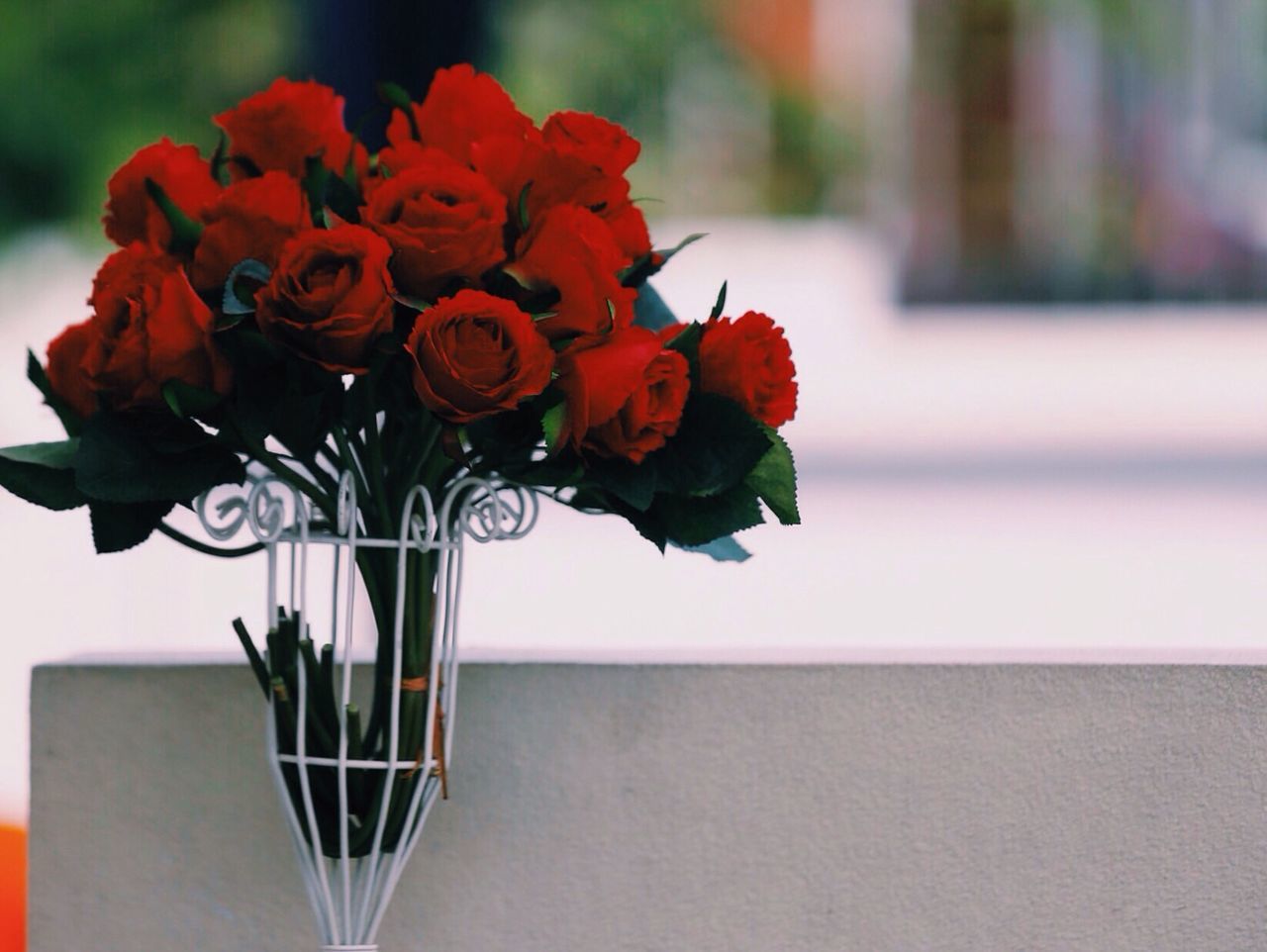 Close-up of rose vase on table at home