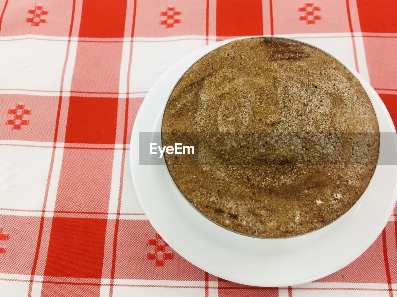 HIGH ANGLE VIEW OF COFFEE ON TABLE IN TILED FLOOR