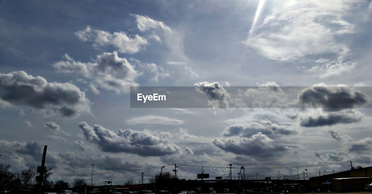 Low angle view of storm clouds in city