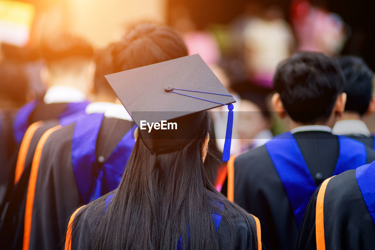 Rear view of woman wearing mortarboard during graduation