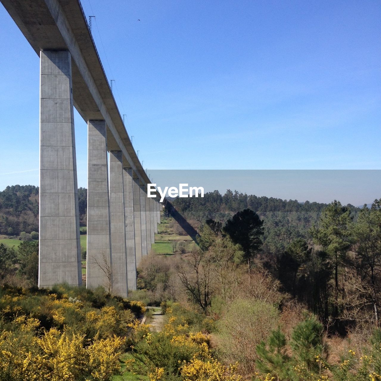 Bridge on field against sky