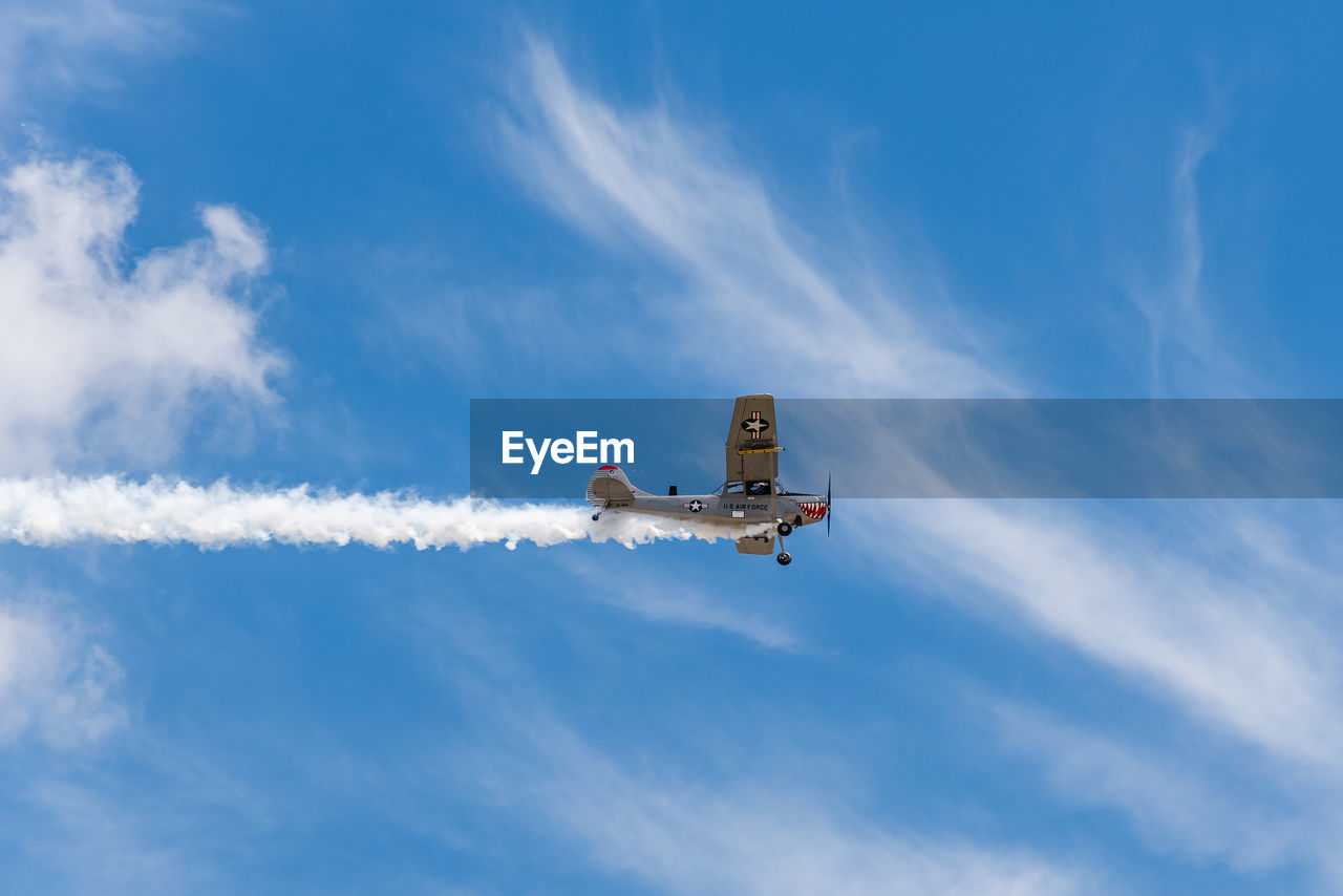 LOW ANGLE VIEW OF AIRPLANE AGAINST SKY