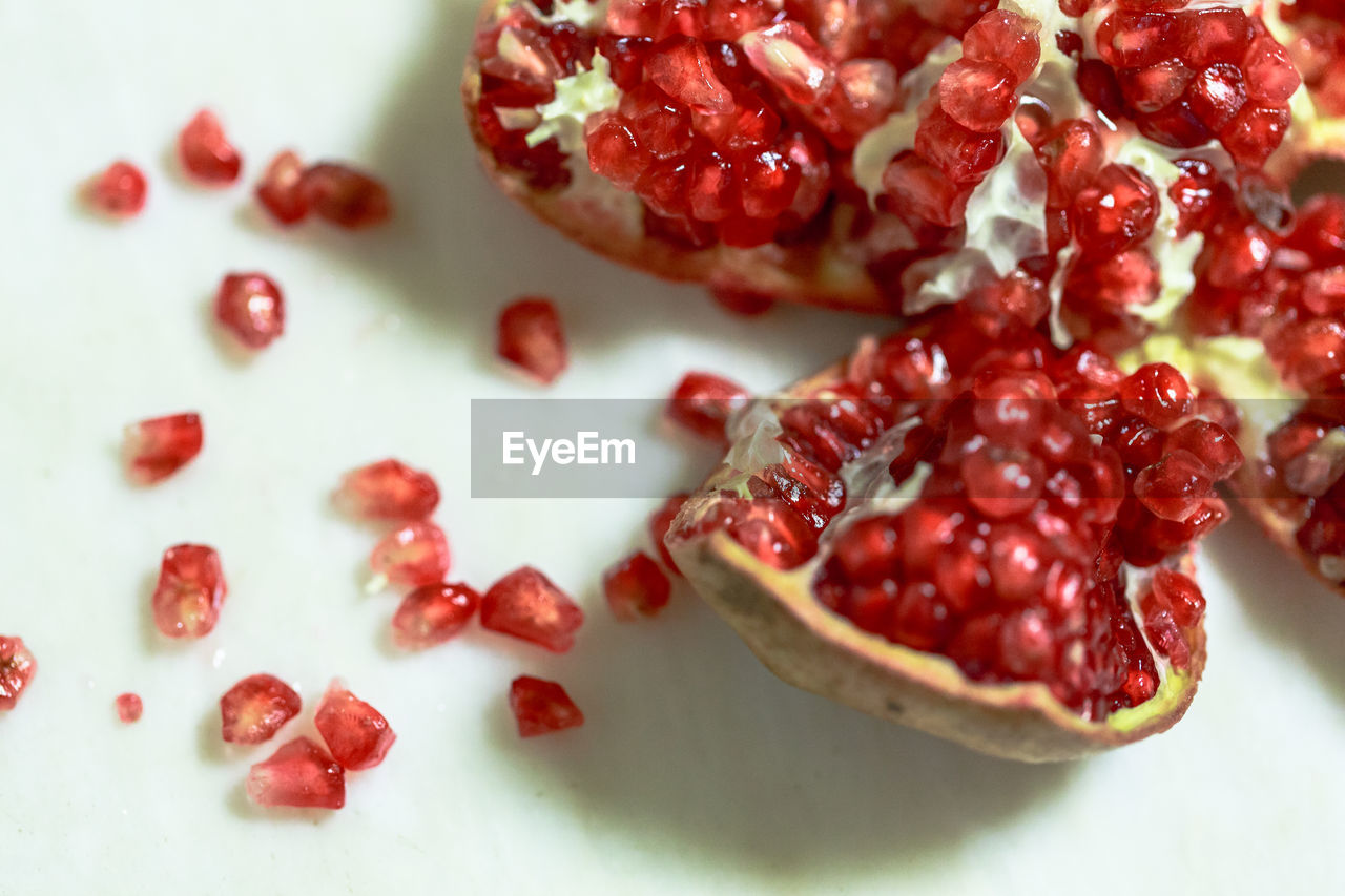 food and drink, food, plant, pomegranate, fruit, healthy eating, pomegranate seed, freshness, wellbeing, red, seed, berry, berries, produce, cranberry, no people, sweet food, indoors, studio shot, close-up, high angle view