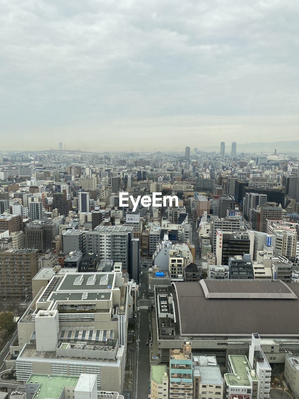 architecture, building exterior, built structure, tower block, city, skyscraper, metropolis, building, cityscape, residential area, aerial photography, day, urban area, no people, residential district, nature, high angle view, sky, outdoors, tower, water, office building exterior, aerial view, downtown