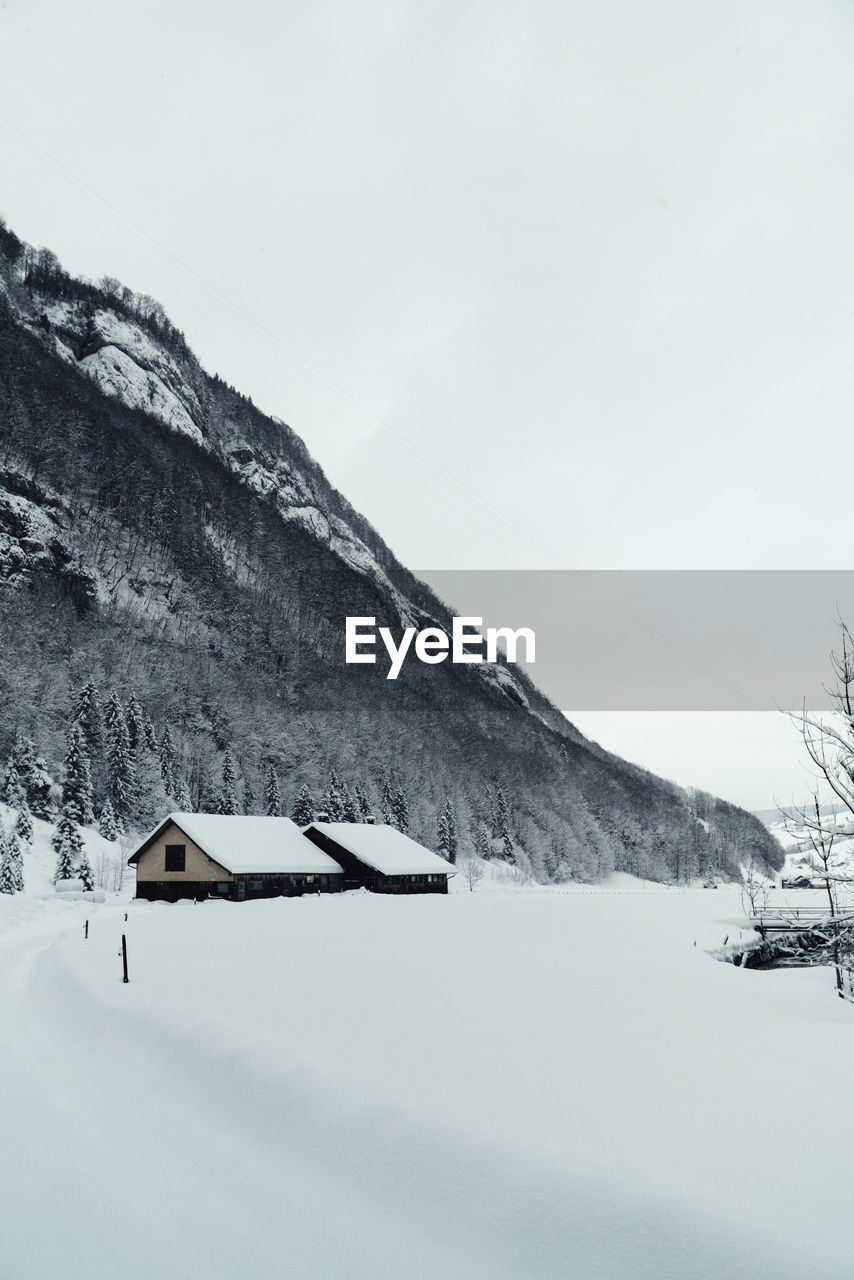 Scenic view of snow covered mountain against sky