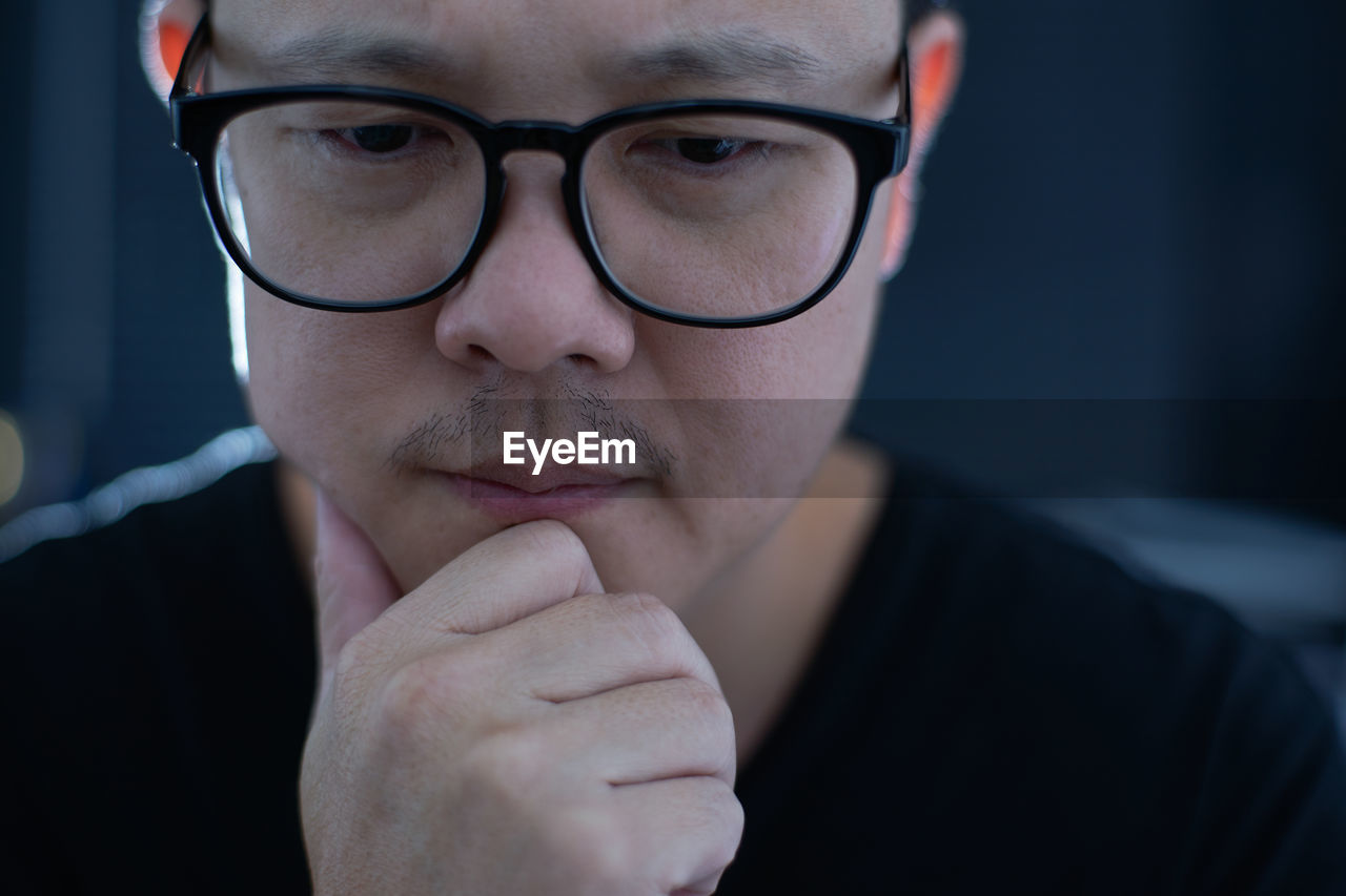 Close-up of man wearing eyeglasses