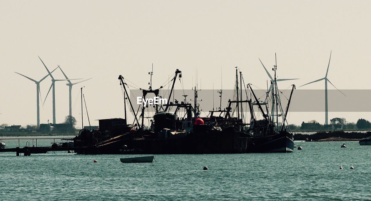 Boats moored at harbor