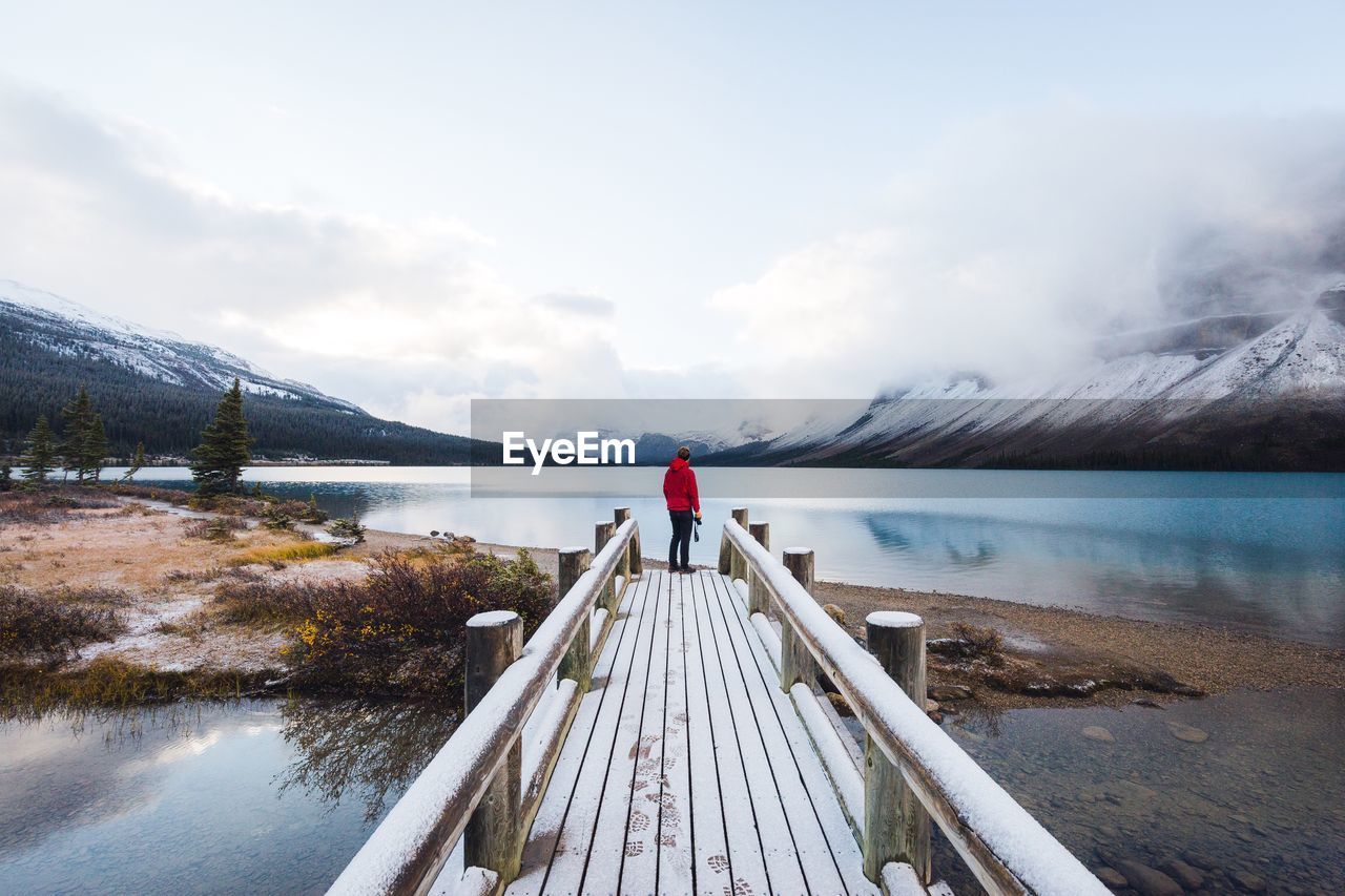 Man on pier over bow lake