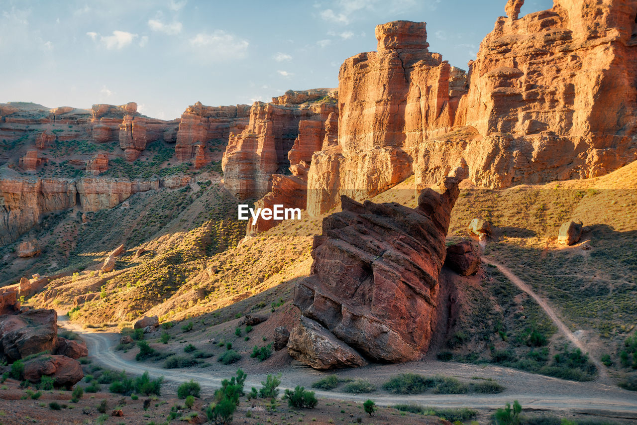 Panoramic view of rock formations against sky