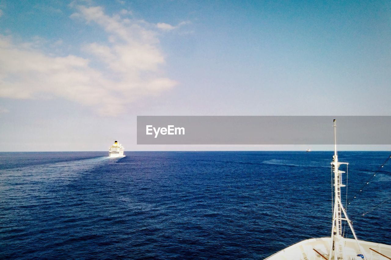 Boat sailing in sea against sky