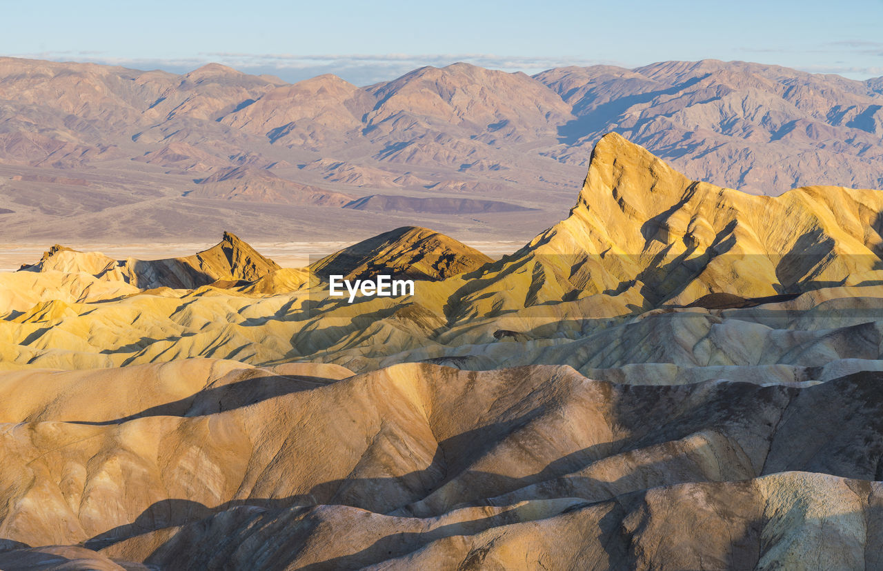 SCENIC VIEW OF ARID LANDSCAPE AGAINST SKY