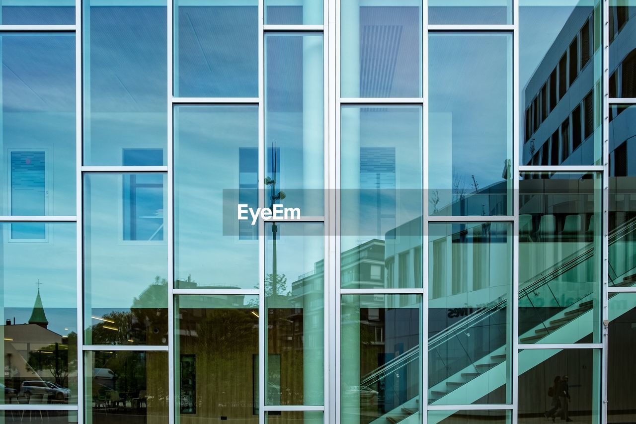 Full frame shot of modern building against blue sky