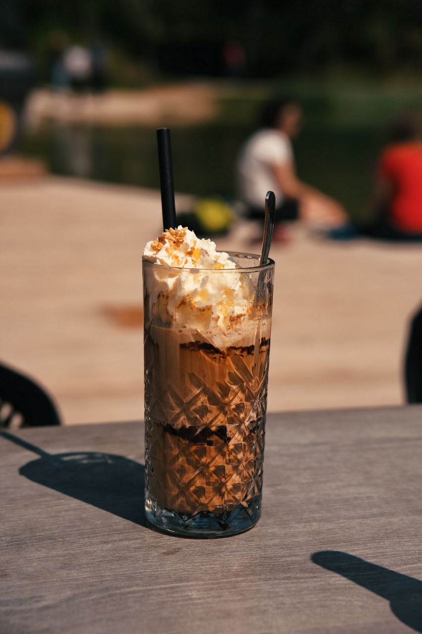 Closeup of ice coffee on the table in nature