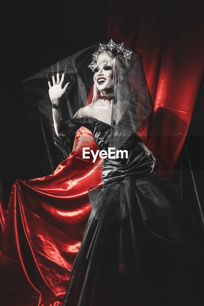 celebration, red, adult, one person, women, clothing, costume, fear, spooky, horror, darkness, indoors, event, dark, dress, black, fashion, portrait, halloween, mystery, arts culture and entertainment, make-up