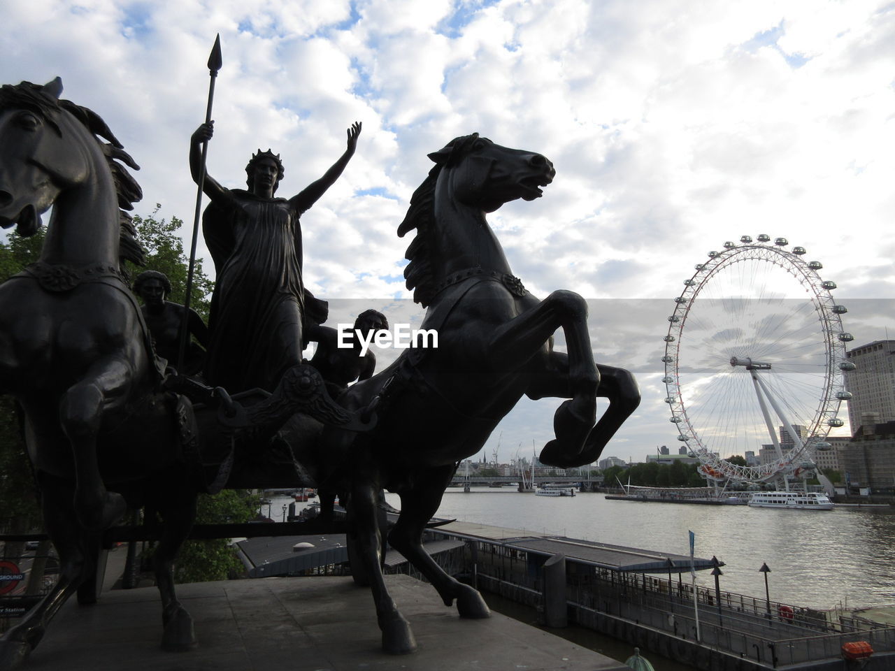 Statue of boudicca and london eye in background