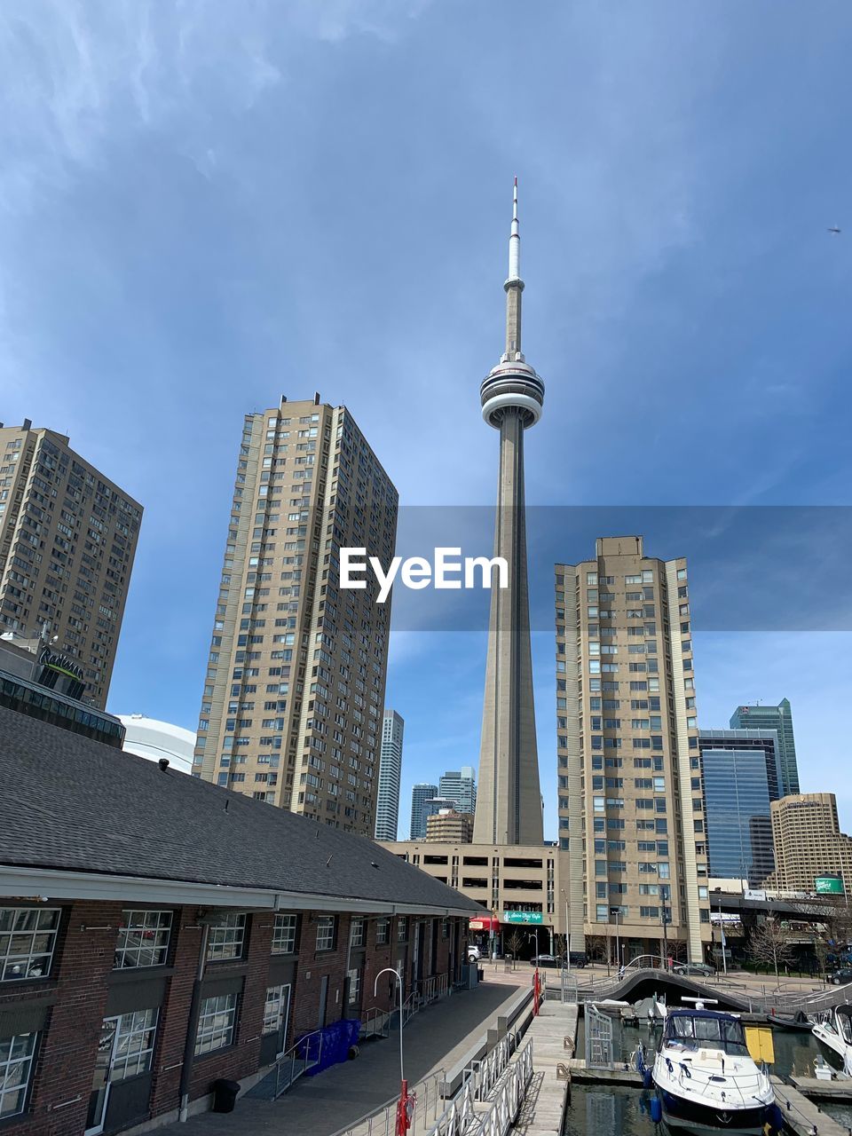 LOW ANGLE VIEW OF BUILDINGS IN CITY AGAINST SKY