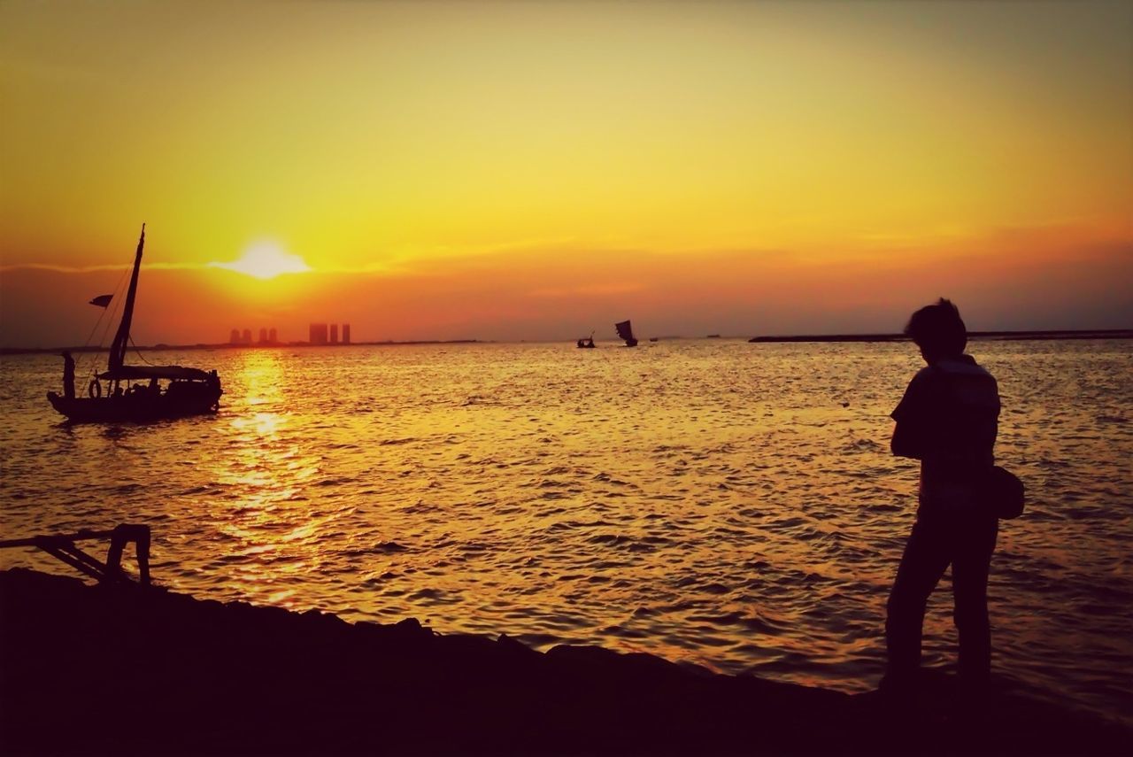 SILHOUETTE OF PEOPLE ON BEACH DURING SUNSET