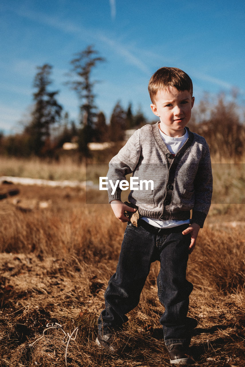 Portrait of boy standing on land