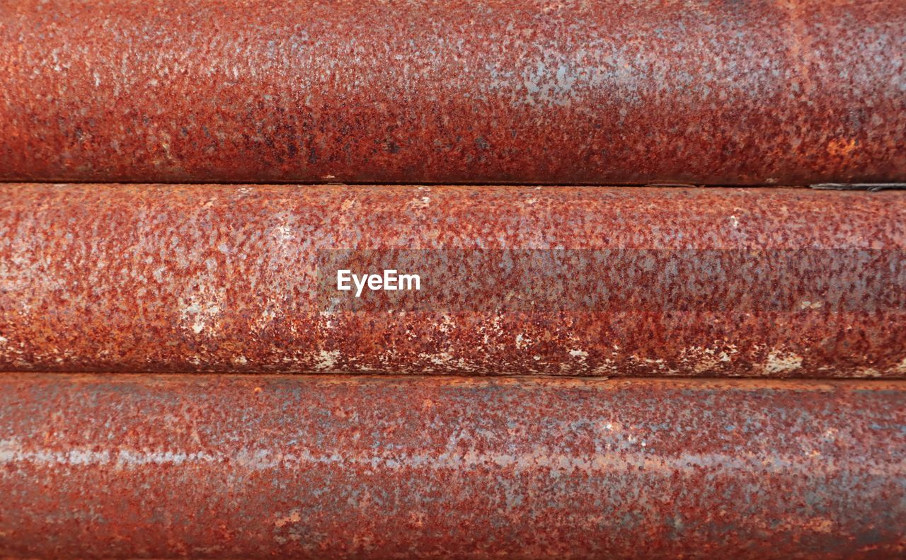 Full frame shot of rusty metallic pipes