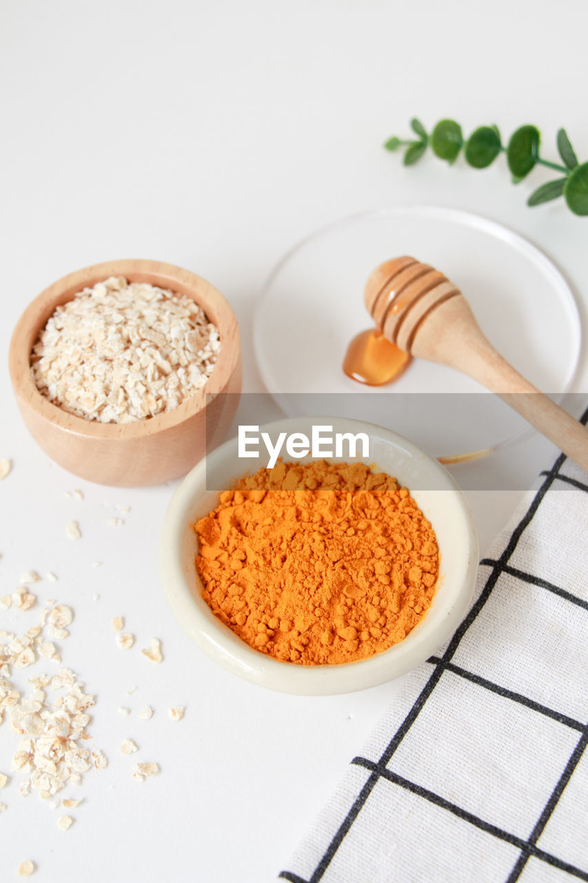food and drink, food, ingredient, studio shot, wellbeing, spice, dish, healthy eating, bowl, kitchen utensil, indoors, freshness, no people, spoon, high angle view, produce, plant, eating utensil, powder, wood, raw food, breakfast, herb, seasoning, ground - culinary