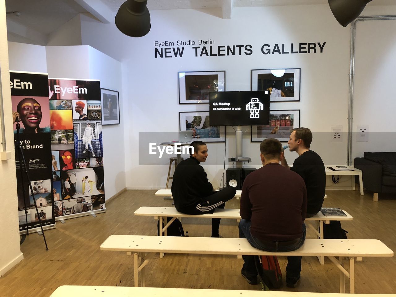 GROUP OF PEOPLE WORKING ON TABLE IN OFFICE