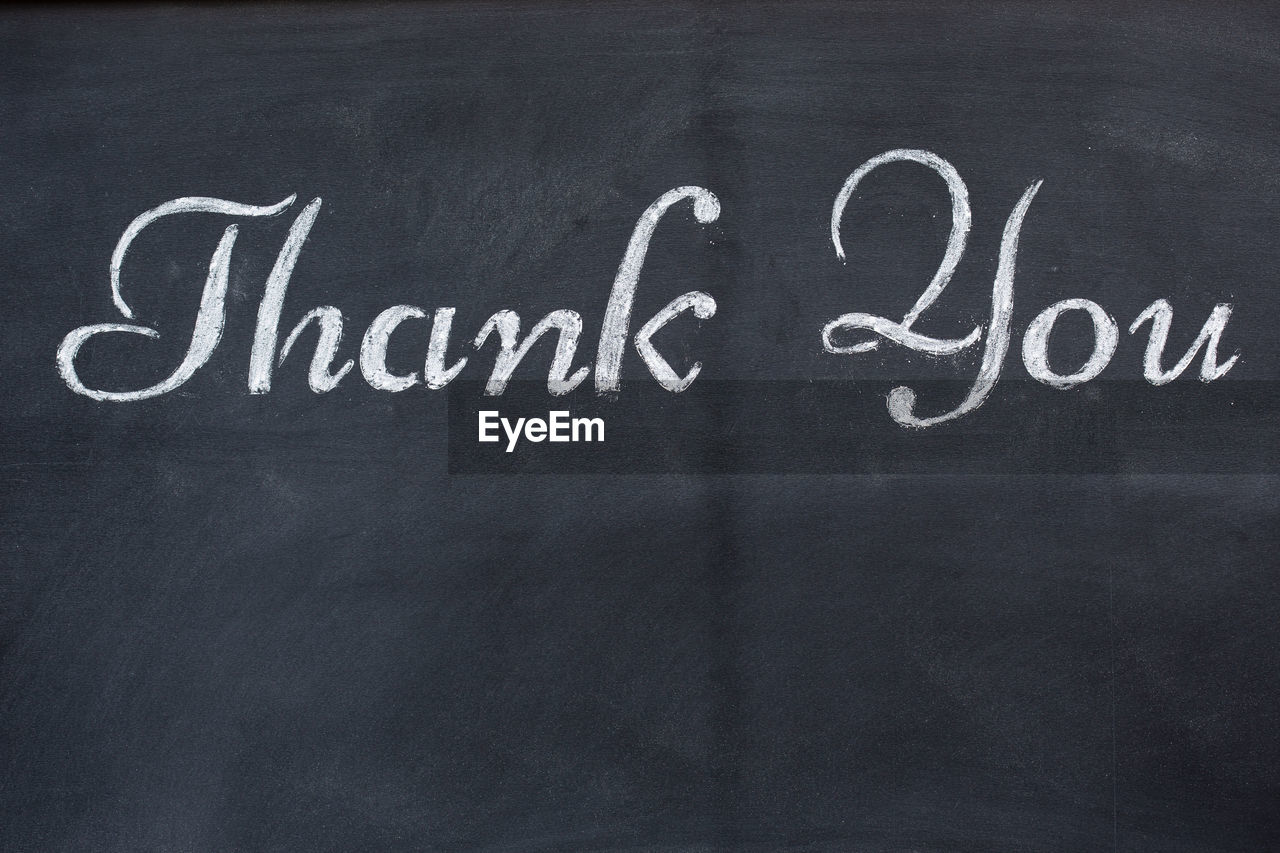 Close-up of text on blackboard