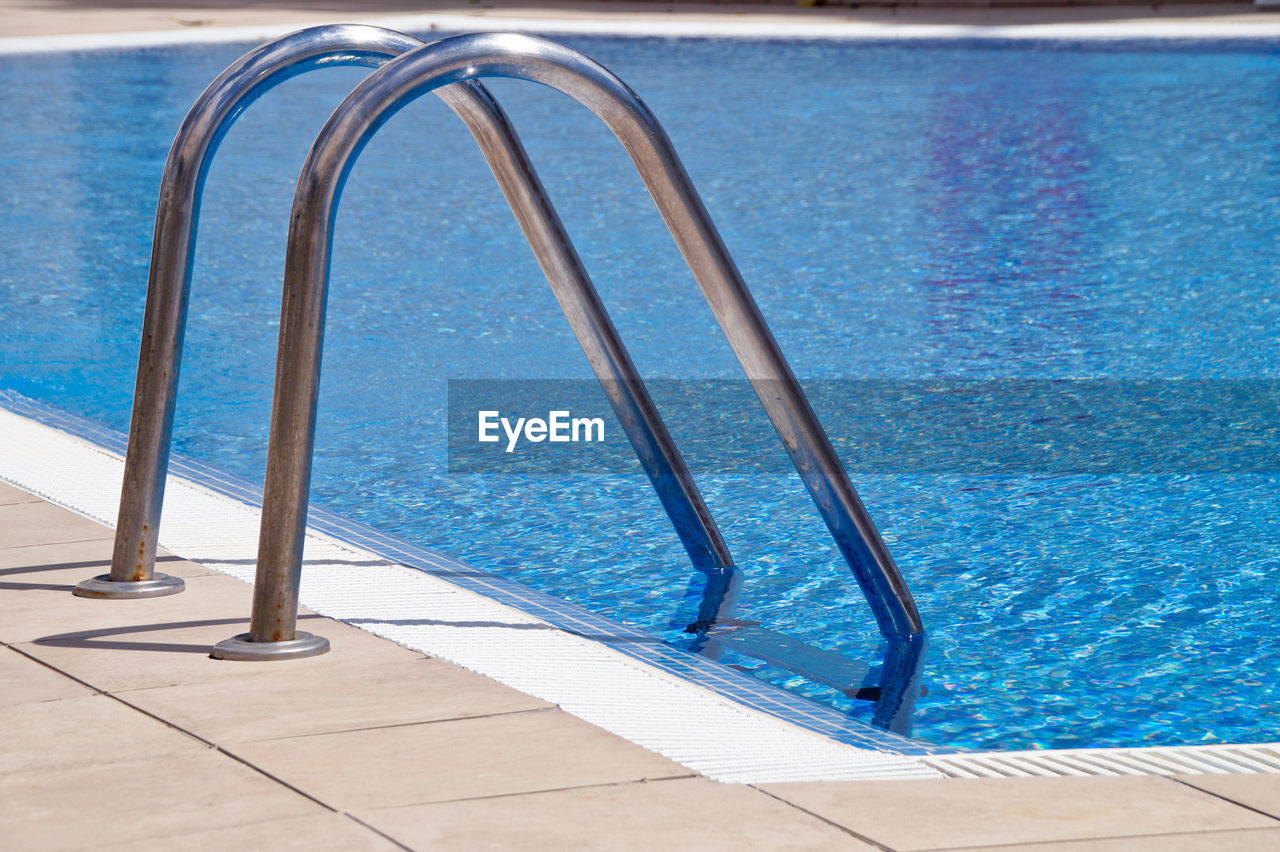 HIGH ANGLE VIEW OF SWIMMING POOL WITH WATER