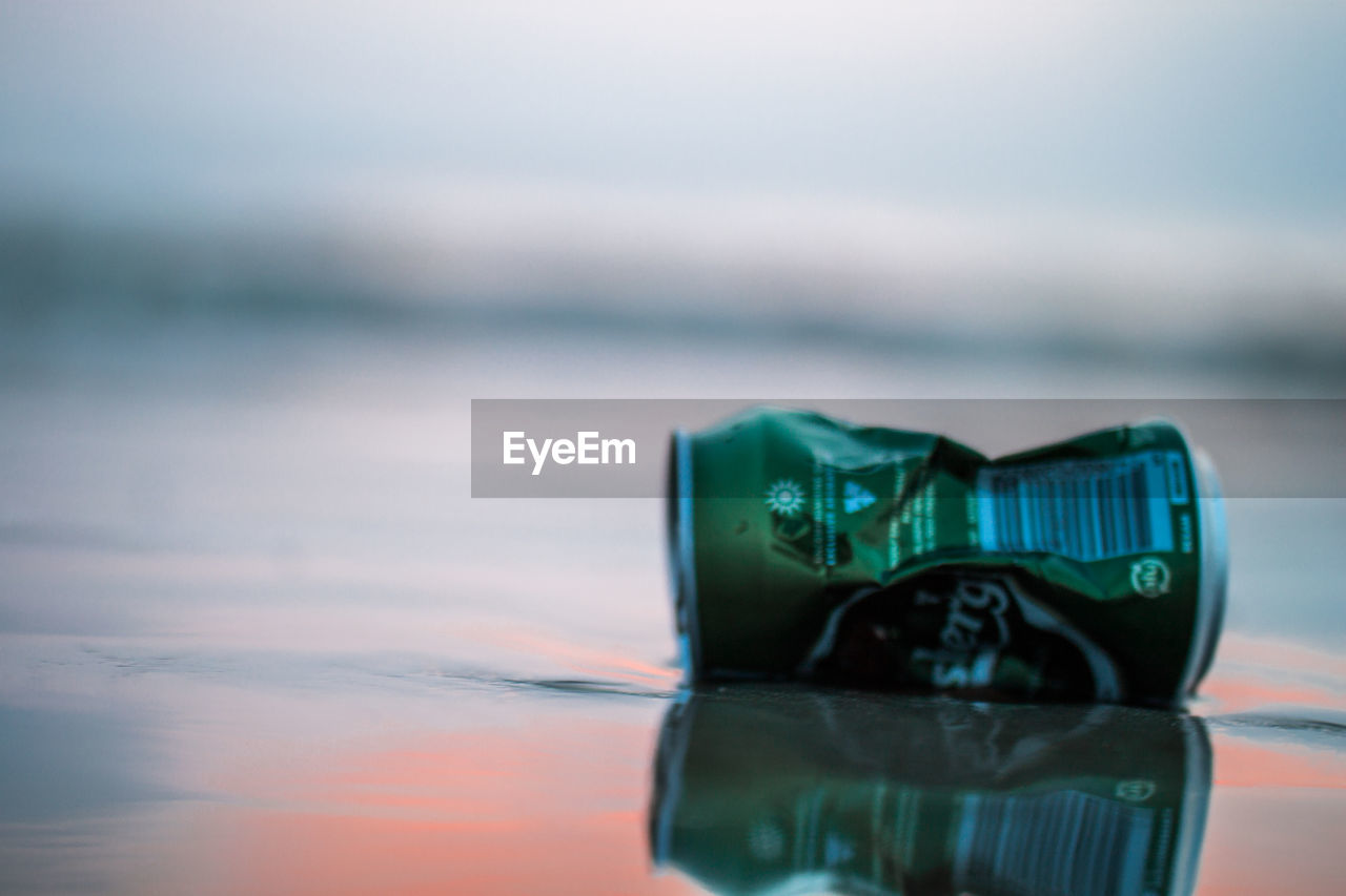 CLOSE-UP OF SUNGLASSES ON TABLE