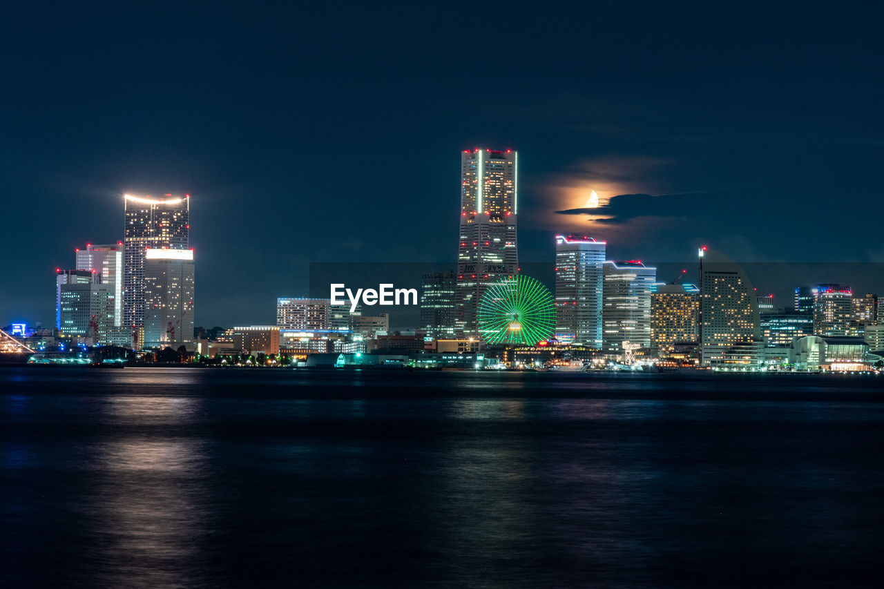 Illuminated buildings in city at night