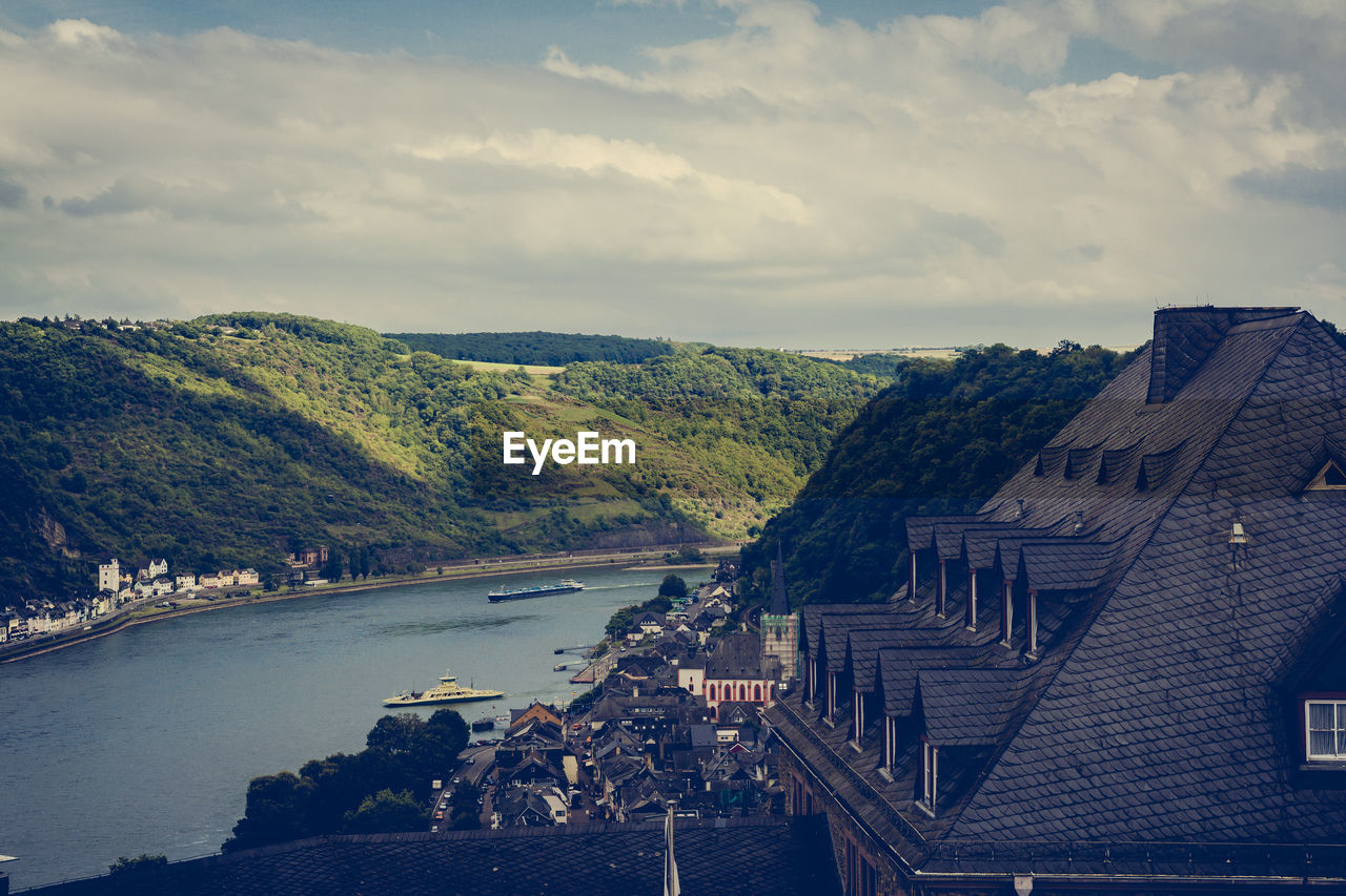 View of town against cloudy sky