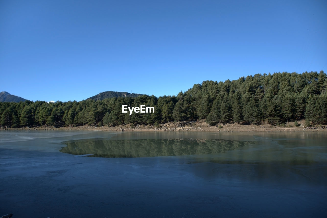 Frozen mountain lake in autumn