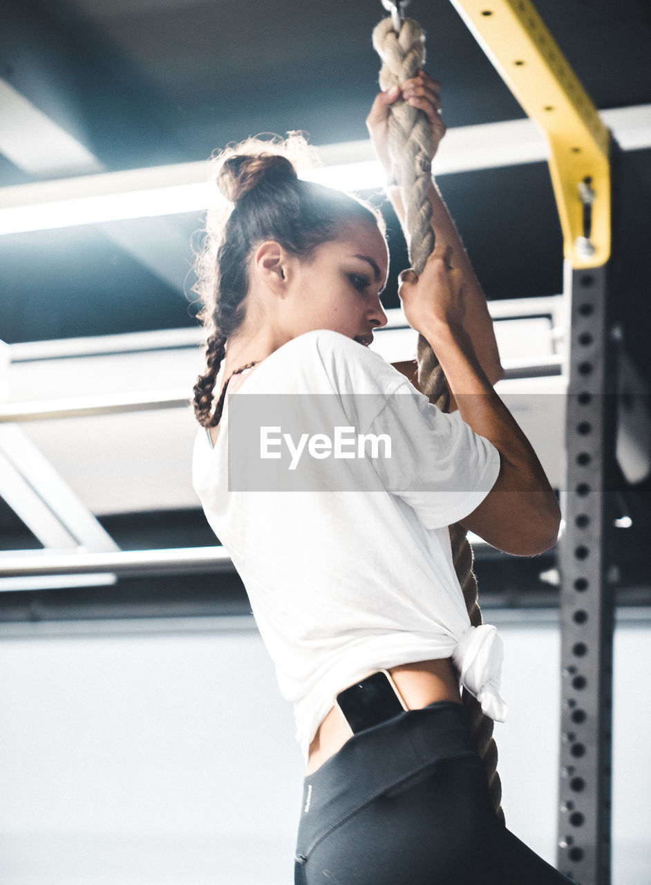 Female athlete exercising in gym