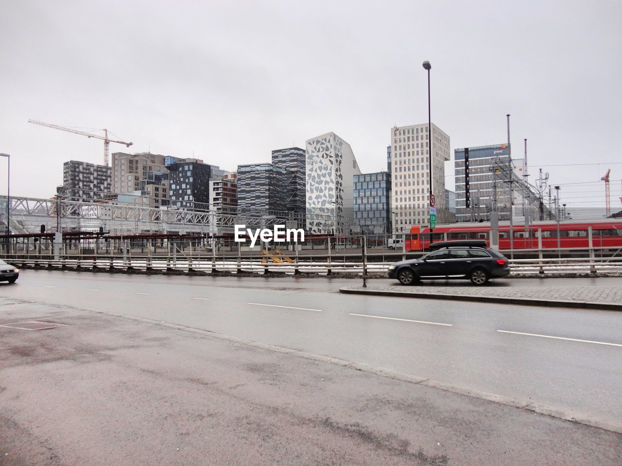 City street by buildings against sky