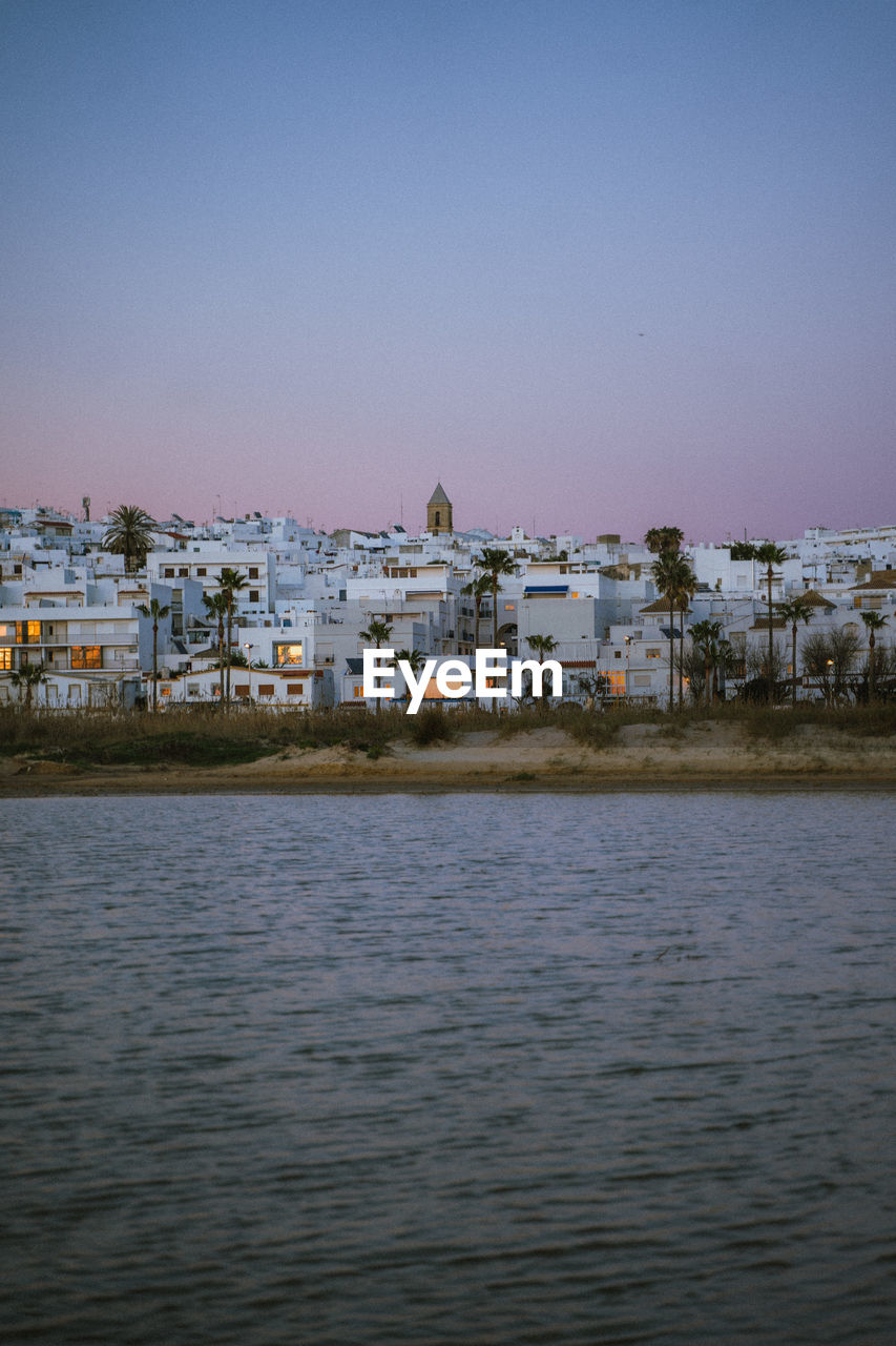 scenic view of sea against clear sky during sunset