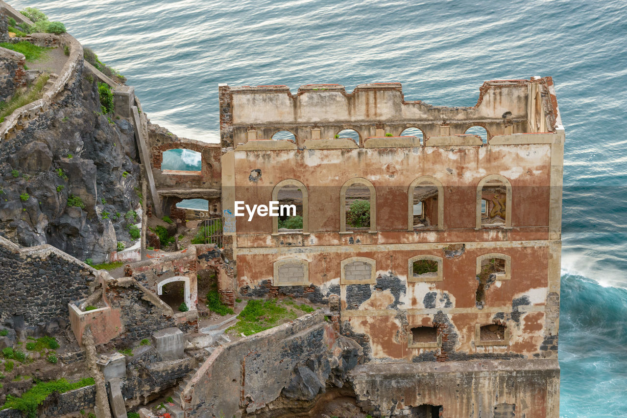 High angle view of old ruin at seaside