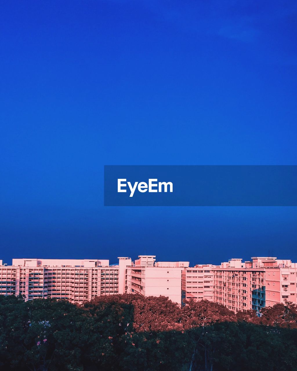 Low angle view of buildings against blue sky