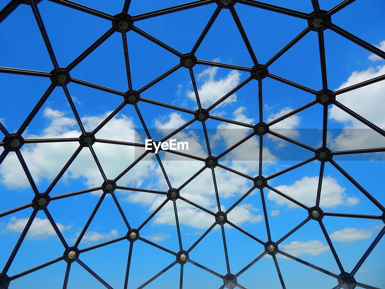 Full frame shot of metallic structure against blue sky