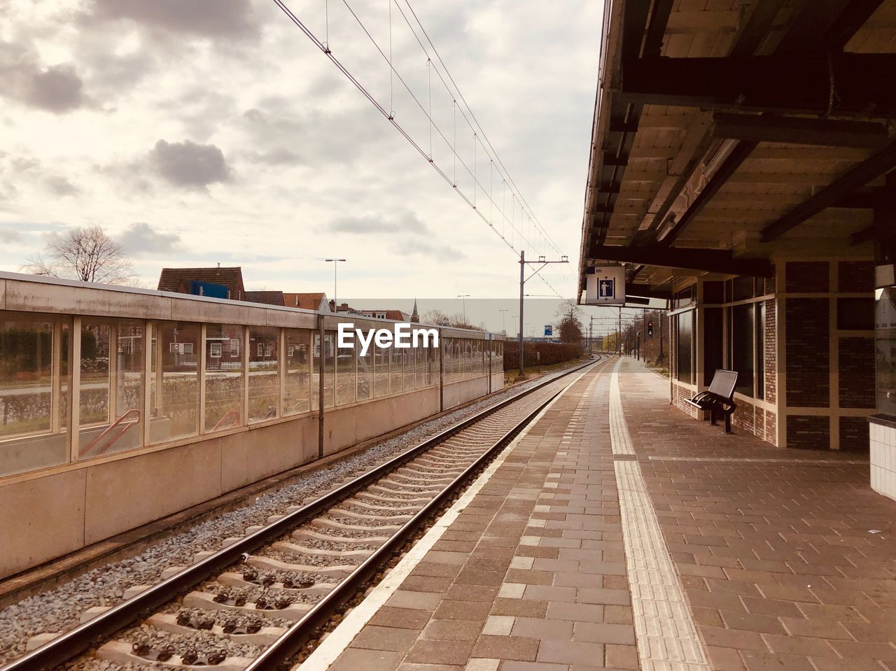 VIEW OF RAILROAD STATION PLATFORM AGAINST SKY