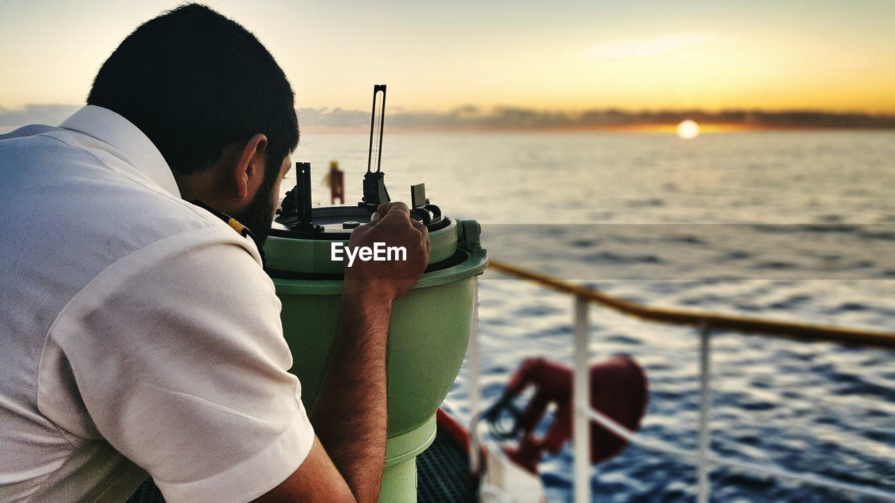 Rear view of man on boat