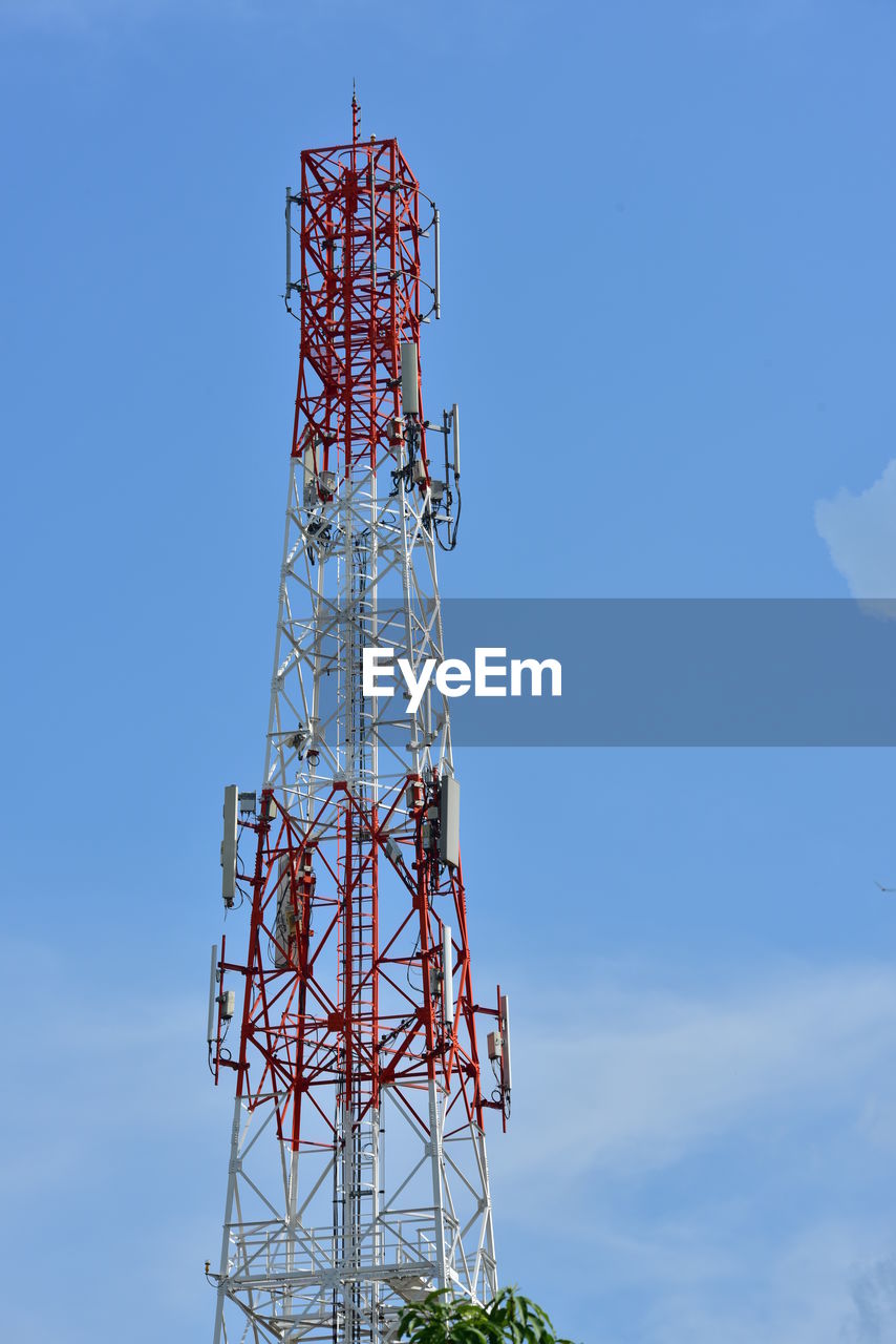 Low angle view of communications tower against sky