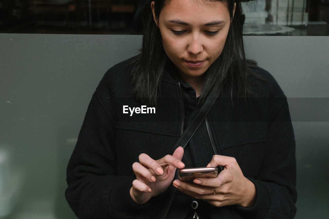 Close-up of woman using mobile phone