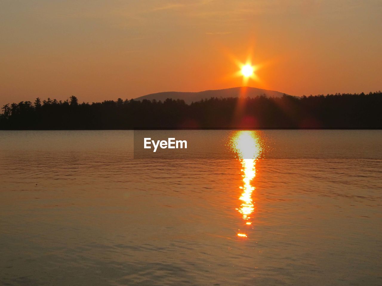 SCENIC VIEW OF SUNSET OVER LAKE