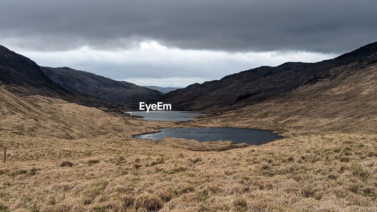 scenic view of landscape and mountains against sky